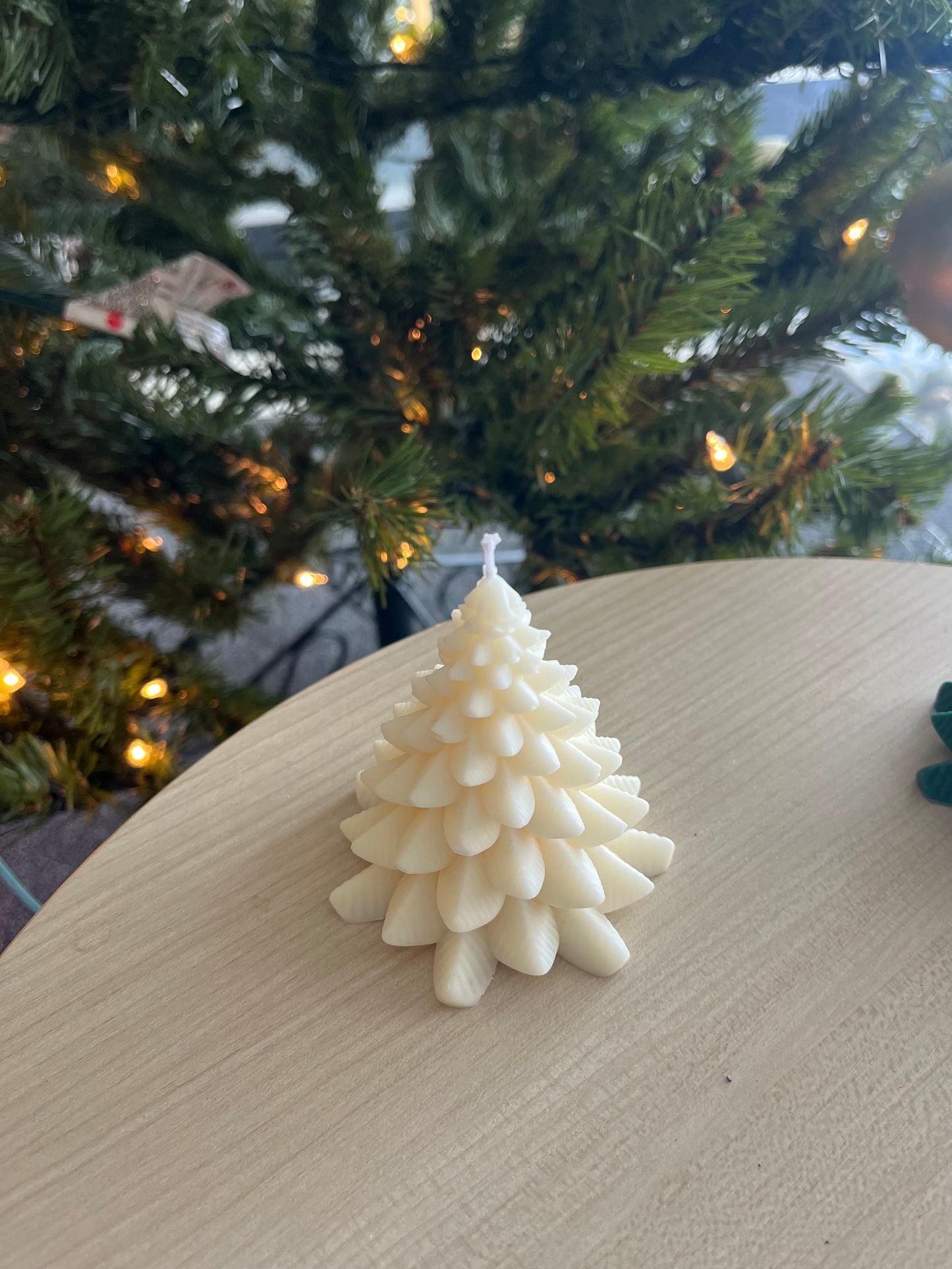 Green and white Christmas tree candle