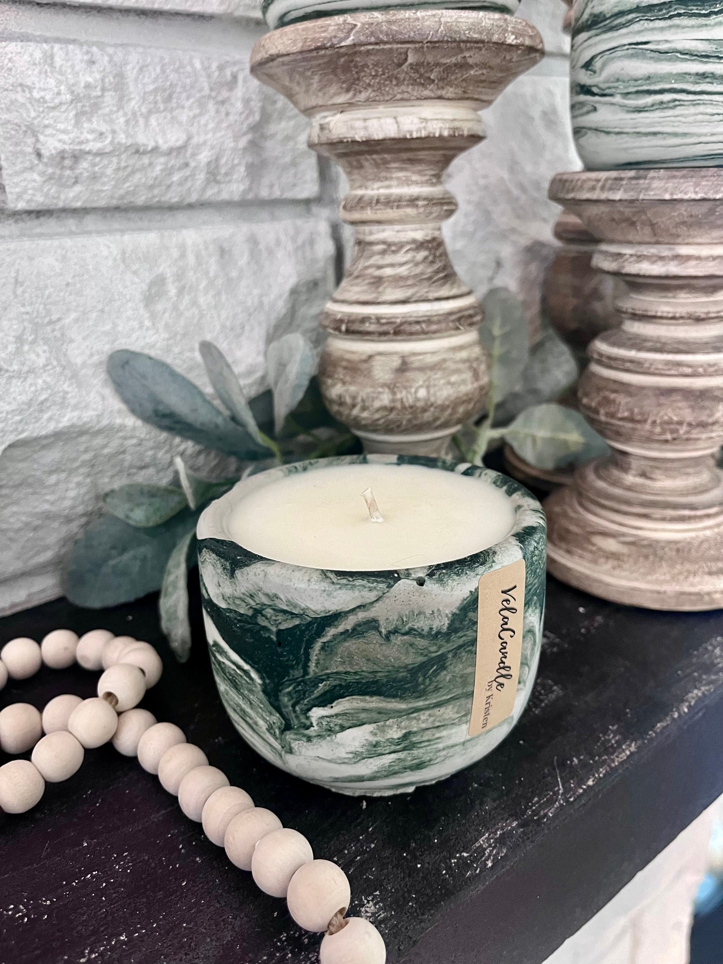 Dark green concrete candle