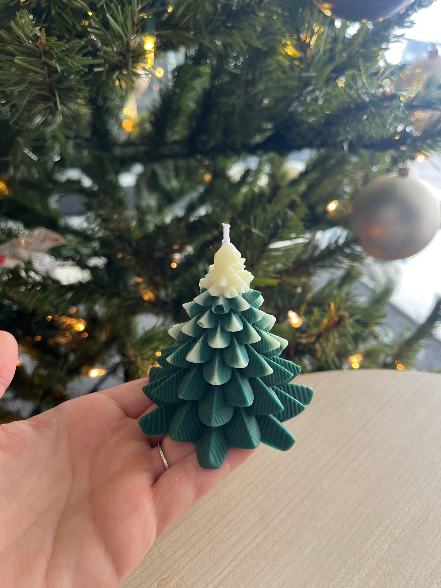 Green and white Christmas tree candle