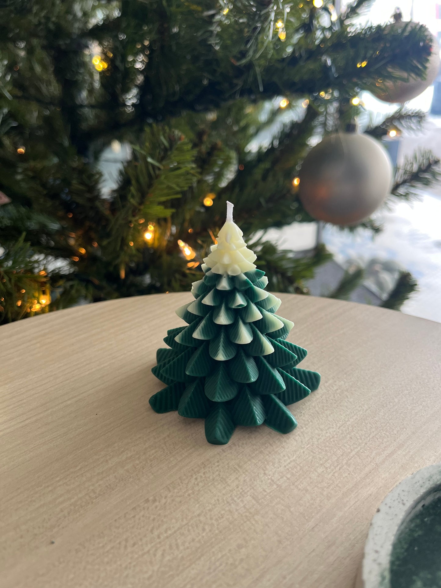 Green and white Christmas tree candle